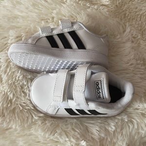 Little kids Adidas shoes.